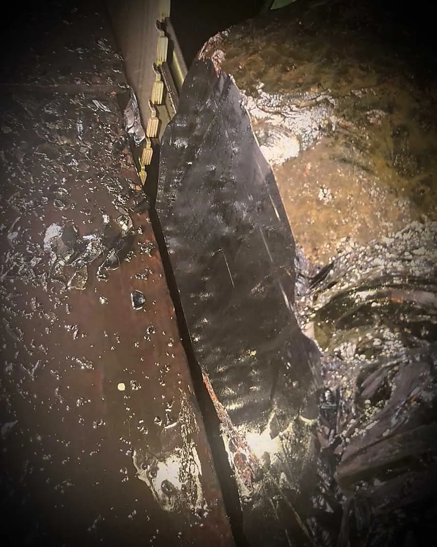 A raw slab of black volcanic obsidian being cut near Teotihuacán
